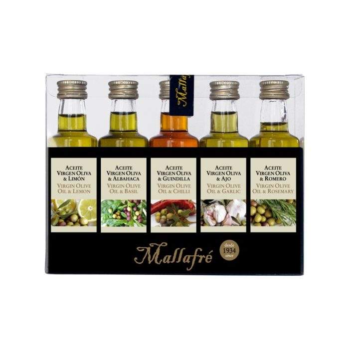 Fünf Miniaturflaschen von Mallafré Olivenöl mit Geschmacksrichtungen: Zitrone, Basilikum, Chili, Knoblauch und Rosmarin, je 40 ml